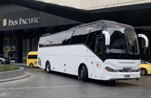 Bus Charter pulling out of Pan Pacific Hotel