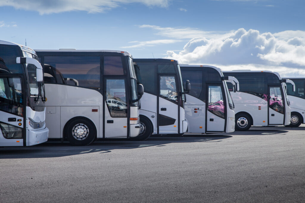 Bus Charter fleet of buses lined up ready to be despatched.