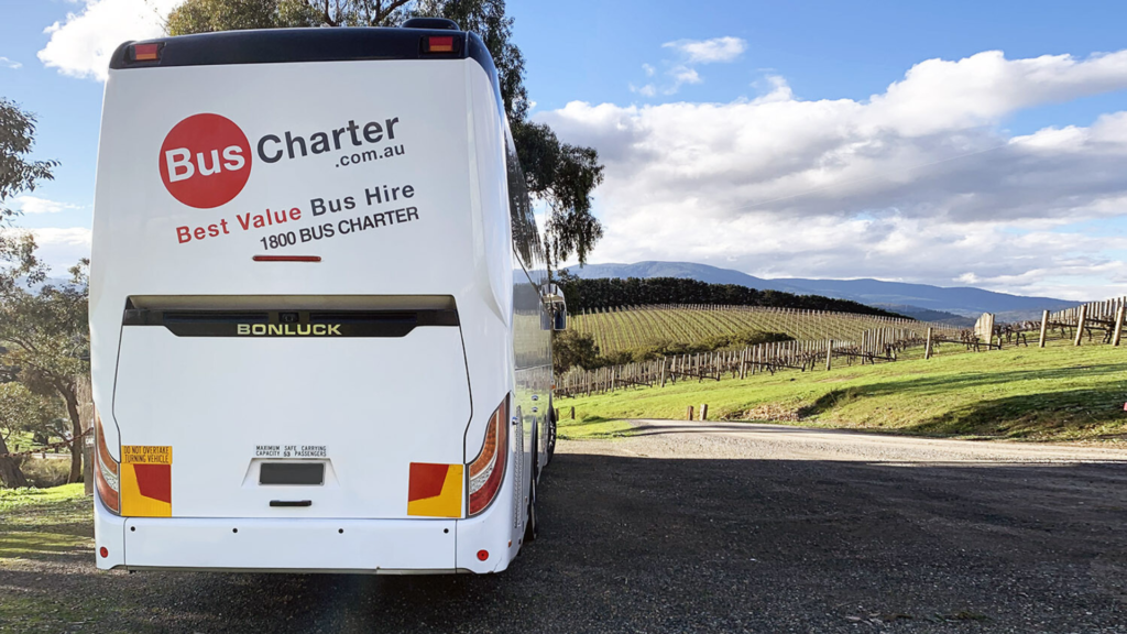 stg-buscharter-stagingbc.kinsta.cloud bus awaiting pick up at vineyard for sightseeing tour